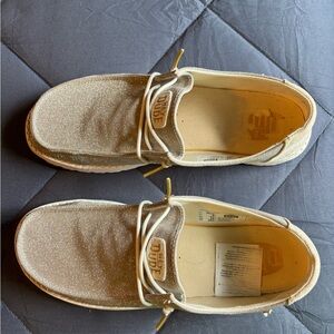 Hey Dude Women's Wally Sparkle Slip-Ons in Champagne